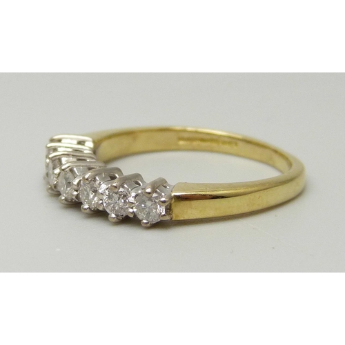 1038 - An 18ct yellow gold ring set with seven round brilliant cut diamonds, approximately 0.33ct, I/J colo... 