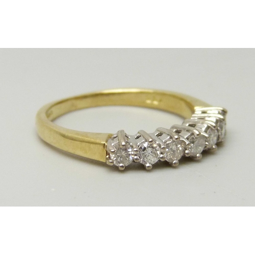 1038 - An 18ct yellow gold ring set with seven round brilliant cut diamonds, approximately 0.33ct, I/J colo... 