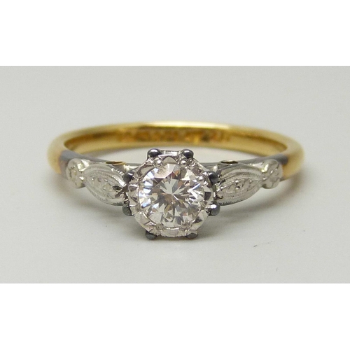 1041 - An 18ct yellow gold and platinum set round brilliant cut diamond solitaire ring, approximately 0.33c... 