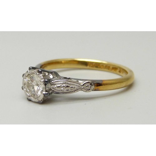 1041 - An 18ct yellow gold and platinum set round brilliant cut diamond solitaire ring, approximately 0.33c... 