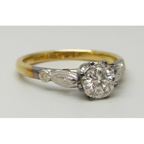 1041 - An 18ct yellow gold and platinum set round brilliant cut diamond solitaire ring, approximately 0.33c... 