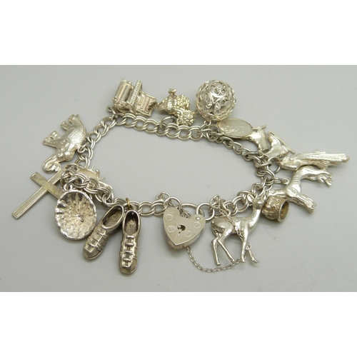 1050 - A silver charm bracelet, 40g