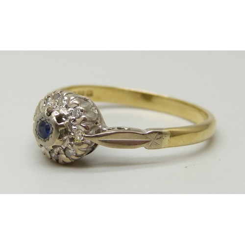 1054 - An 18ct gold, sapphire and diamond cluster ring, 2.8g, M/N