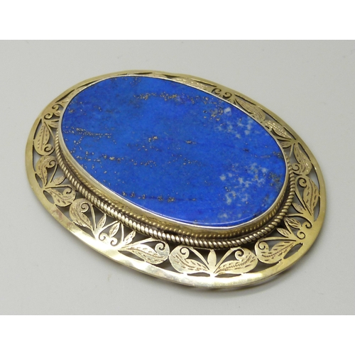 1055 - A large lapis lazuli and silver gilt brooch, 6cm x 8cm