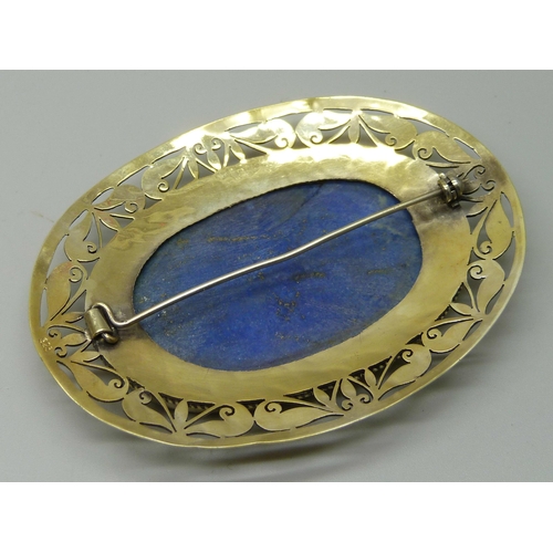 1055 - A large lapis lazuli and silver gilt brooch, 6cm x 8cm