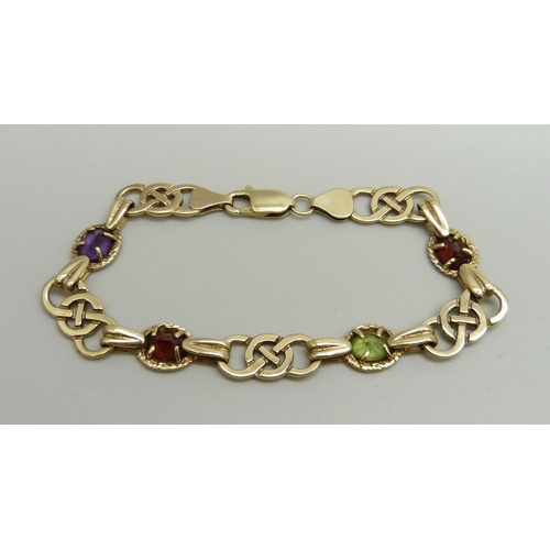 1063 - A Celtic style 9ct gold multi-gem bracelet, 11.9g