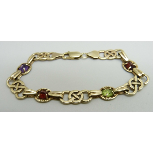 1063 - A Celtic style 9ct gold multi-gem bracelet, 11.9g