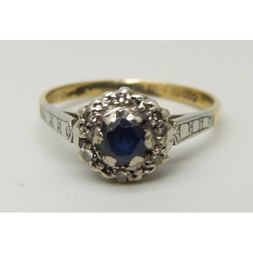 1066 - An 18ct gold, sapphire and diamond cluster ring, 2.5g, M