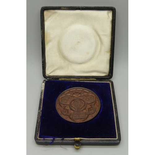 1070 - A Nottingham High School bronze medallion to G.B. Bryan, Good Conduct 1891 inscription, cased