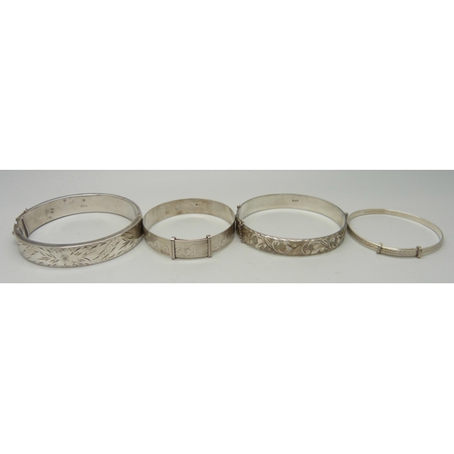 1074 - Four silver bangles, 55g