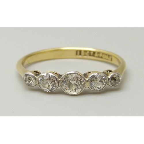 1079 - An 18ct gold and five stone diamond ring, all stones old cut, centre stone measures approximately 3.... 