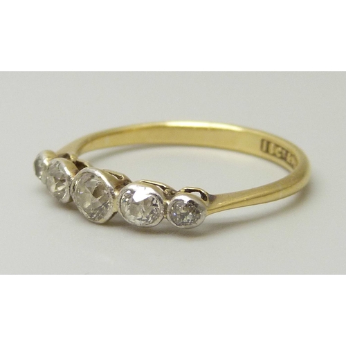 1079 - An 18ct gold and five stone diamond ring, all stones old cut, centre stone measures approximately 3.... 