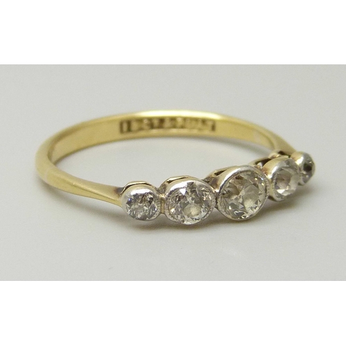 1079 - An 18ct gold and five stone diamond ring, all stones old cut, centre stone measures approximately 3.... 