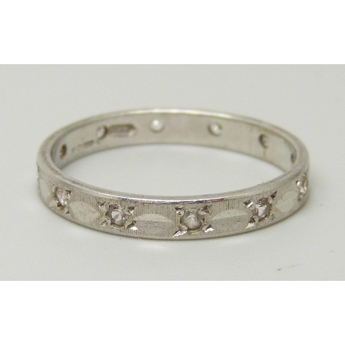 1080 - A 9ct white gold and synthetic white spinel eternity ring, 1.9g, O