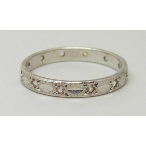 1080 - A 9ct white gold and synthetic white spinel eternity ring, 1.9g, O