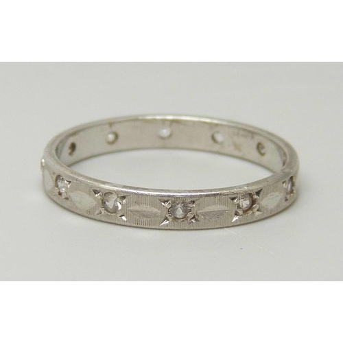 1080 - A 9ct white gold and synthetic white spinel eternity ring, 1.9g, O