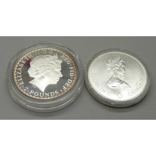 1098 - A one once fine silver Britannia £2 coin and a 1976 Olympiad five dollars silver coin