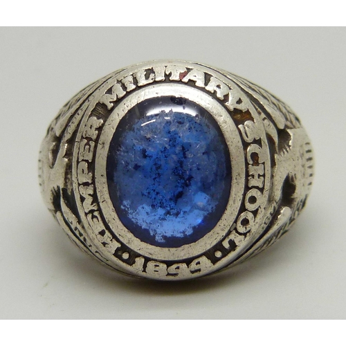 1100 - A sterling graduation ring, Kemper Military School, set with a blue stone, P, stone a/f