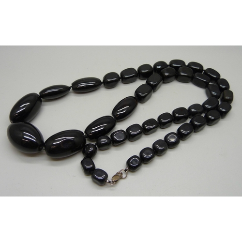 1168 - A large heavy black bead necklace with silver fastener, possibly obsidian, length 85cm, 276g