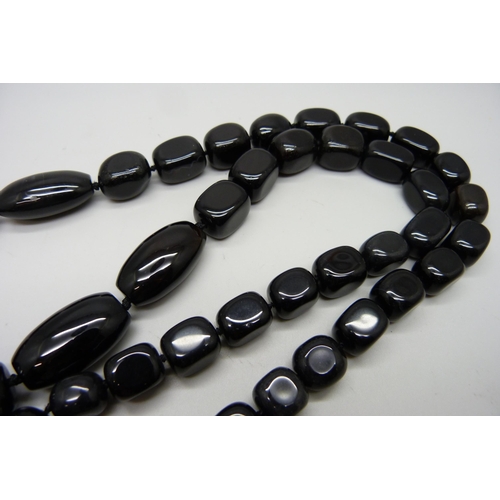 1168 - A large heavy black bead necklace with silver fastener, possibly obsidian, length 85cm, 276g