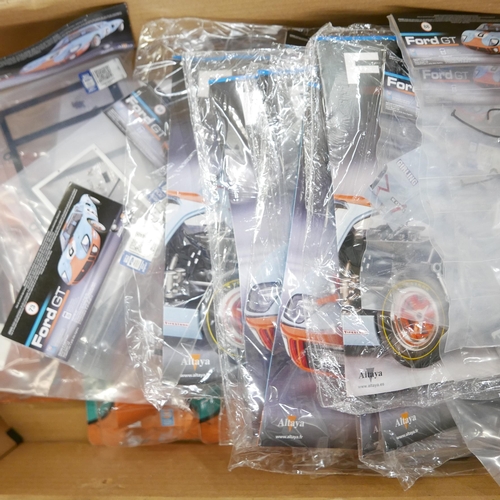 1225 - A quantity of DeAgostini build your own Ford GT40 sealed parts **PLEASE NOTE THIS LOT IS NOT ELIGIBL... 