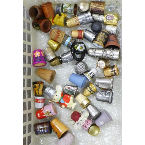 1240 - A large collection of thimbles including Royal Albert, Aynsley and Mason's, etc. **PLEASE NOTE THIS ... 