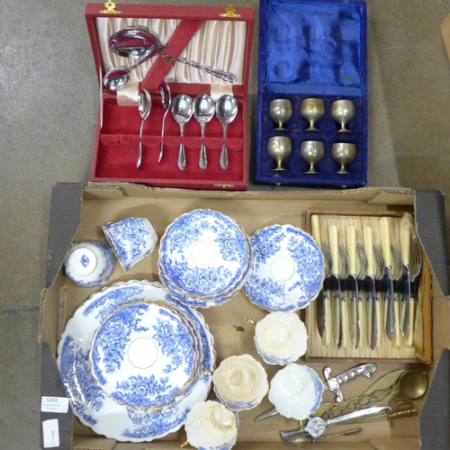 1242 - Blue and white teaware, flatware, four letter openers, etc. **PLEASE NOTE THIS LOT IS NOT ELIGIBLE F... 