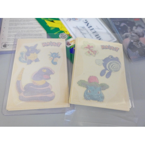 664 - A collection of Japanese Disney 100 cards and Pokemon tattoos