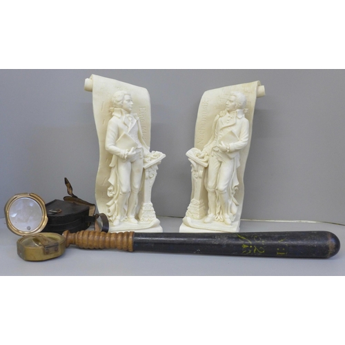 678 - A Police truncheon, a brass compass, cased and a pair of Mozart figural bookends