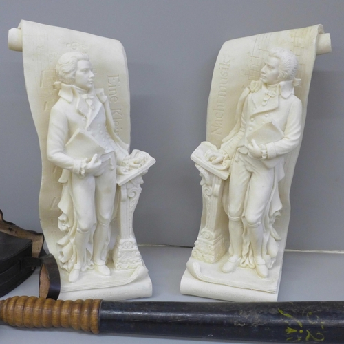 678 - A Police truncheon, a brass compass, cased and a pair of Mozart figural bookends