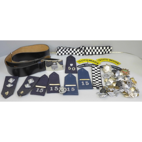 680 - A collection of Police memorabilia including leather belt, epaulettes, badges and buttons, the major... 