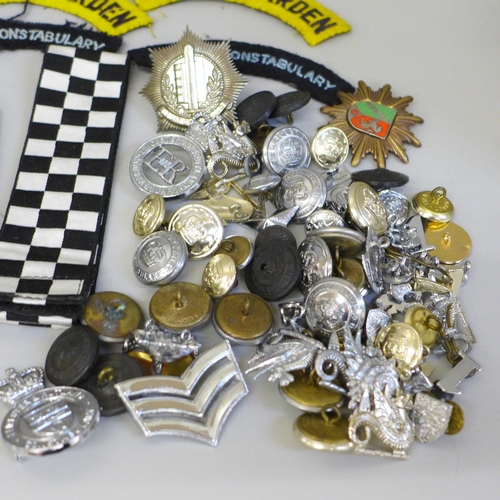 680 - A collection of Police memorabilia including leather belt, epaulettes, badges and buttons, the major... 