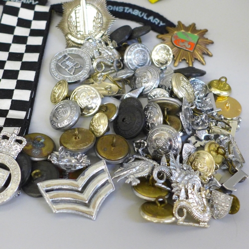 680 - A collection of Police memorabilia including leather belt, epaulettes, badges and buttons, the major... 