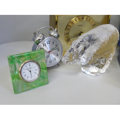 687 - A collection of vintage 20th Century travel clocks including glass and a Pukeberg paperweight; a Eur... 