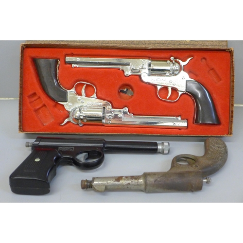 693 - Two pellet guns and a pair of Mustang boxed cap guns