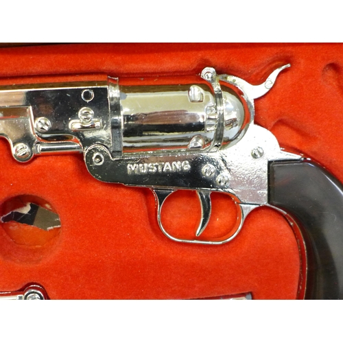 693 - Two pellet guns and a pair of Mustang boxed cap guns