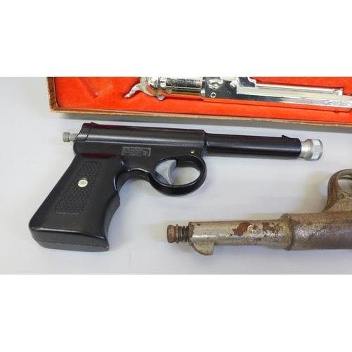 693 - Two pellet guns and a pair of Mustang boxed cap guns