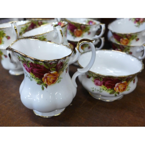 694 - Royal Albert Old Country Roses china, ten cups, saucers and tea plates, cream and sugar and vase