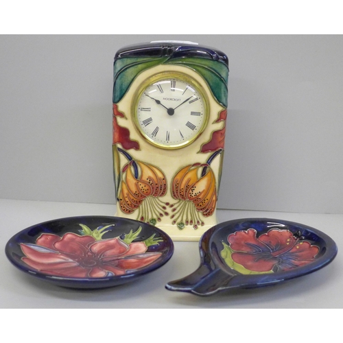 697 - A Moorcroft Anna Lily mantel clock and two Anemone pin dishes