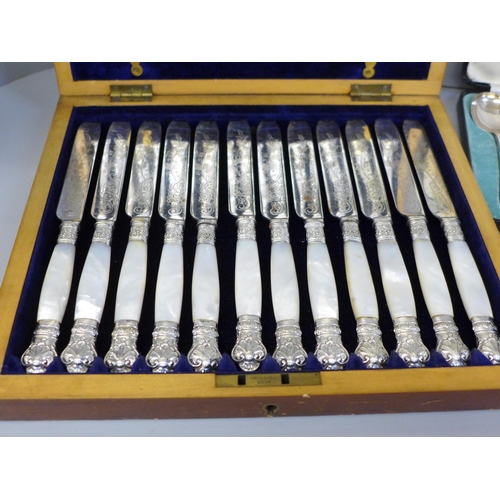 700 - A cased set of 24 silver plate and mother of pearl fish knives and forks, a cased set of six Walker ... 