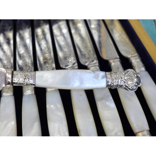 700 - A cased set of 24 silver plate and mother of pearl fish knives and forks, a cased set of six Walker ... 