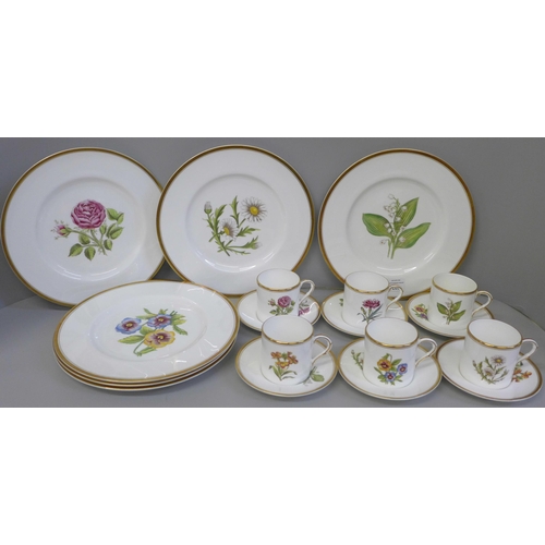 702 - A set of six Royal Worcester hand painted coffee cans, saucers and plates, decorated with flowers, o... 