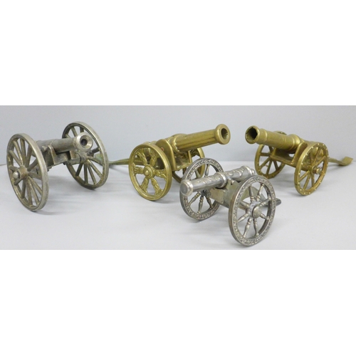 722 - Four model cannons, two plate and two brass