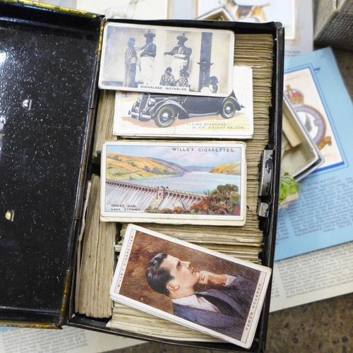 727 - A collection of cigarette cards, albums and silks