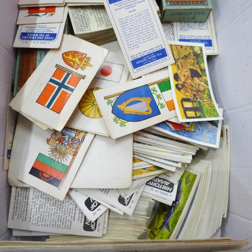 727 - A collection of cigarette cards, albums and silks