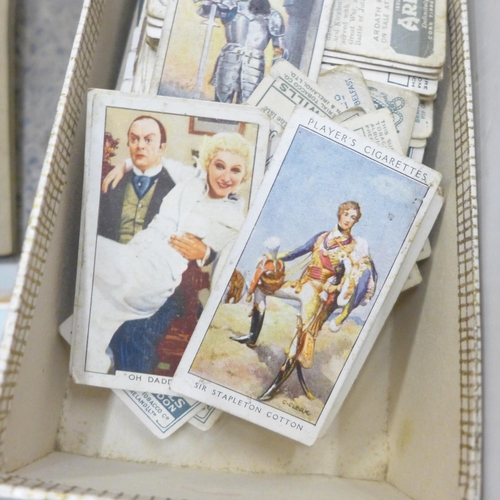 727 - A collection of cigarette cards, albums and silks