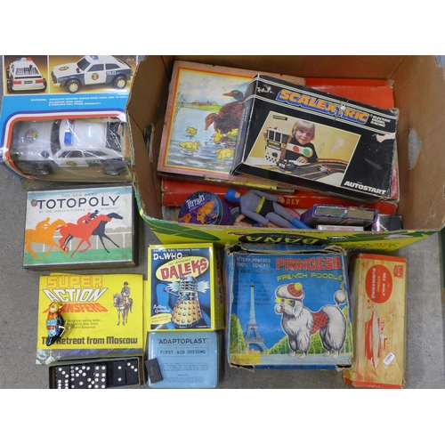 737 - A box of vintage toys and games including Sutcliffe Atomic Submarine, Totopoly, battery powered poli... 