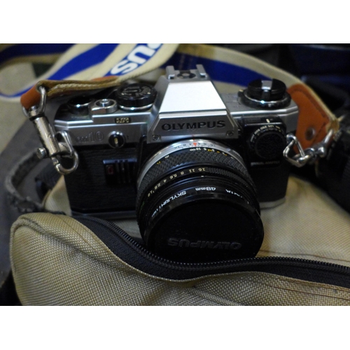 744 - A collection of 35mm SLR cameras, video camera and digital camera including Olympus, Nikon, Sony and... 