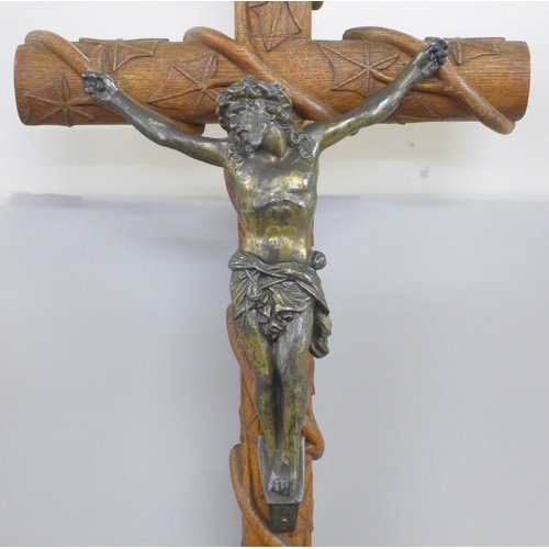 812 - A large oak and gilt spelter altar crucifix, 66cm