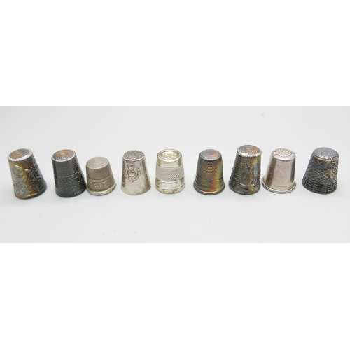 880 - Eight silver thimbles and one other thimble